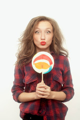 Teenage girl with a big lollipop