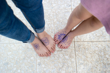 Painted tattoos on children feet