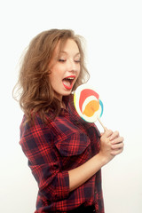 Teenage girl with a big lollipop