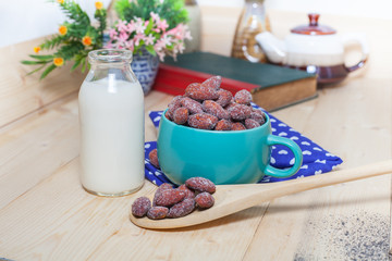 Obraz na płótnie Canvas almonds with milk on table. Selective focus, shallow DOF