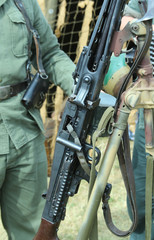 Soldier armed guard with a big gun