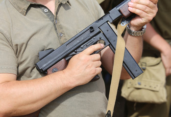 soldier in uniform with a gun in his hand in training camp