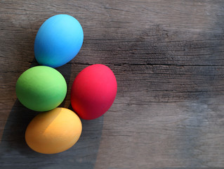Easter eggs on wooden background .