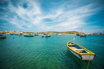 Fototapeta na wymiar fishing boats near village of Marsaxlokk 