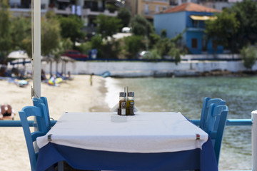 Fototapeta na wymiar Table set in restaurant on seaside