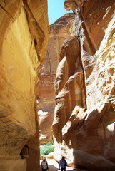 The long, hot road in the ancient city of Petra. Jordan. The road runs between the rocks and through narrow gorges. Ancient caves like home. The remains of an ancient aqueduct. Spring 2010.
