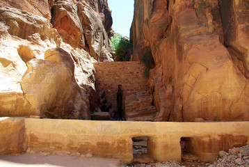 The long, hot road in the ancient city of Petra. Jordan. The road runs between the rocks and...