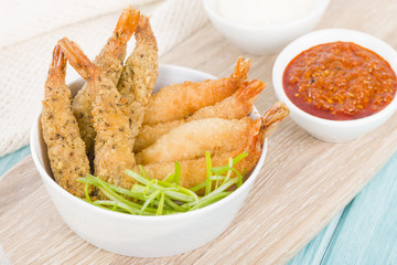 Breaded Prawns - King prawns coated in plain and spicy breadcrumbs and deep-fried.

