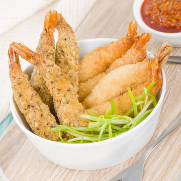 Breaded Prawns - King prawns coated in plain and spicy breadcrumbs and deep-fried.

