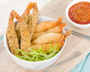 Breaded Prawns - King prawns coated in plain and spicy breadcrumbs and deep-fried.

