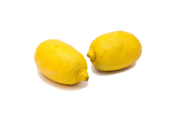 Two ripe lemons. Isolated on white background 