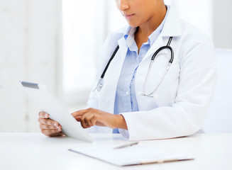african female doctor with tablet pc