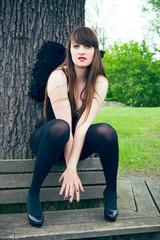 Woman with black angel wings