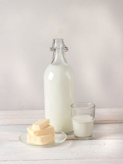 Dairy products on white wooden table.