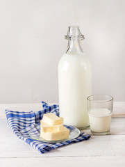 Dairy products on white wooden table.