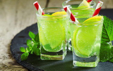 Mint soda with lemon and lime, selective focus