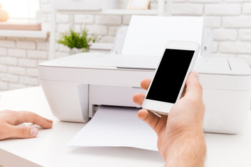 Man's hand working with copier