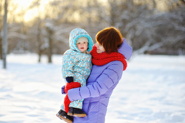 Young woman with toddler at the winter