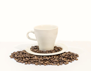 Cup of coffee with coffee beans, on white background