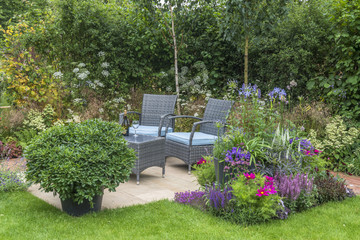 Outdoor living, chairs and table set up in the garden
