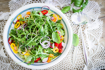 A big bowl of fresh salad. Top view, selective focus.