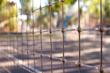 Rusty old armored fence. The small depth of field.