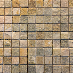 Brown tile on the wall texture and backgroud.
