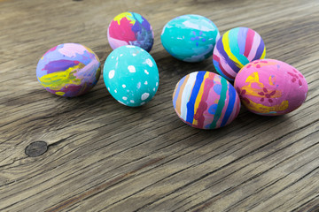 Easter eggs on wooden background. Selective focus.