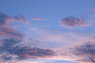 Fototapeta na wymiar blue sky with red evening clouds
