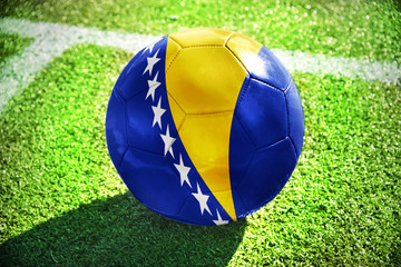 football ball with the national flag of bosnia and herzegovina on the field