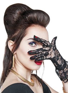 Portrait of young beautiful woman wearing lacy gloves isolated