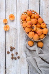 Harvest of fresh apricots in a wicker basket