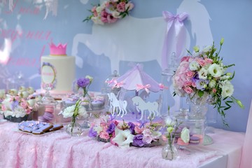 table with flowers and a dessert