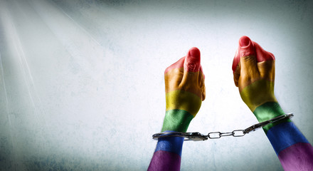 handcuffed hands - denunciation of the criminalization of homosexuality 