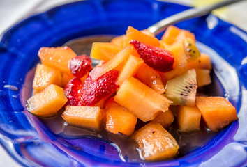 Fruit dessert on ceramic plate at Italian restaurant.