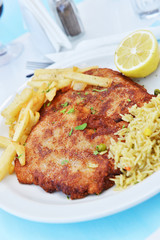 Fried pork chops with fries