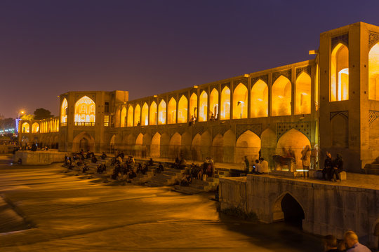 ISFAHAN, IRAN - APRIL 28, 2015: unidentified people resting in t