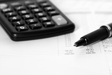 Accounts pen calculator.
Business accounts with a pen and calculator.