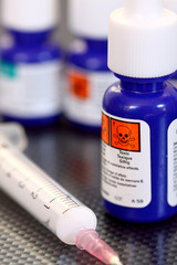 Chemicals syringe.
Bottles of chemicals with a syringe.
