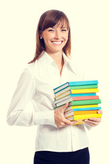 Portrait of smiling woman with textbooks