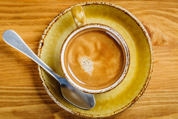 cup of fresh espresso on table