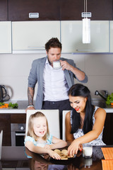 Obraz premium beautiful little girl drinking milk and cookies