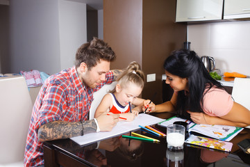 parents with a daughter draw