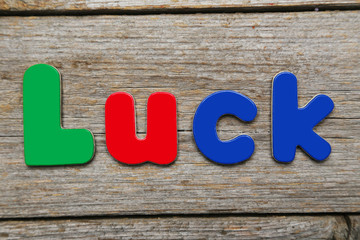 Luck word made of colorful magnets