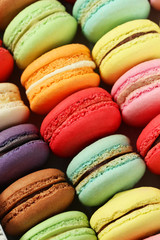 Fototapeta na wymiar French colorful macarons background, close up