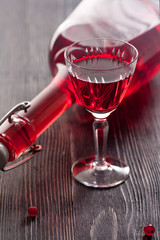 Red wine with red currant berries