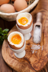 Boiled eggs on a wooden background