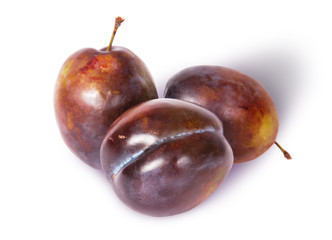 Three violet plums top view