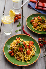 Homemade semolina spaghetti with cherry