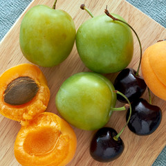 cherries, green plums and apricots